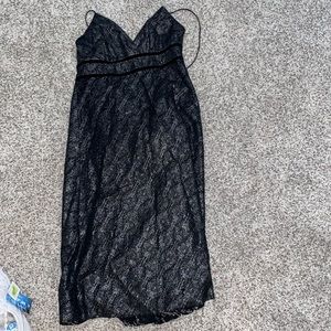 Black and silver med length dress